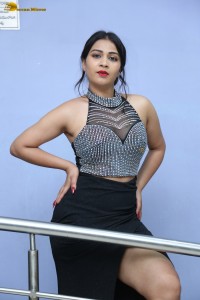 actress Inaya Sultana in a black top and matching skirt
