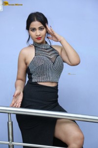 actress Inaya Sultana in a black top and matching skirt