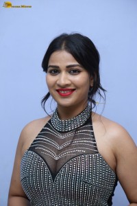 actress Inaya Sultana in a black top and matching skirt