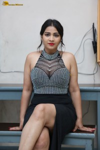 actress Inaya Sultana in a black top and matching skirt