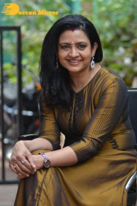 Telugu Actress Indraja in a dark gold color dress