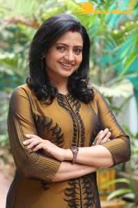 Telugu Actress Indraja in a dark gold color dress