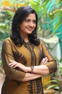 Telugu Actress Indraja in a dark gold color dress