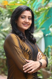 Telugu Actress Indraja in a dark gold color dress