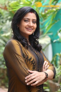 Telugu Actress Indraja in a dark gold color dress
