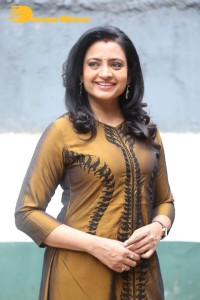 Telugu Actress Indraja in a dark gold color dress