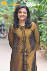 Telugu Actress Indraja in a dark gold color dress
