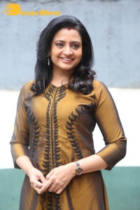 Telugu Actress Indraja in a dark gold color dress