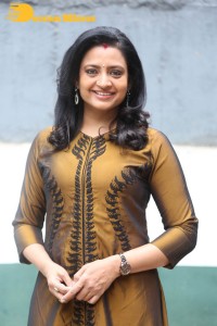 Telugu Actress Indraja in a dark gold color dress