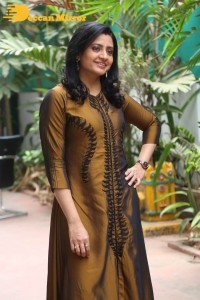 Telugu Actress Indraja in a dark gold color dress