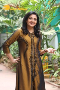 Telugu Actress Indraja in a dark gold color dress