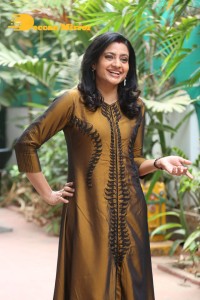 Telugu Actress Indraja in a dark gold color dress