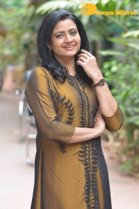 Telugu Actress Indraja in a dark gold color dress
