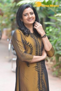 Telugu Actress Indraja in a dark gold color dress