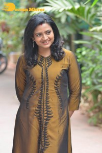 Telugu Actress Indraja in a dark gold color dress
