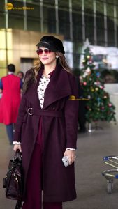 actress Isha Koppikar stylish in sunglasses and a long red coat