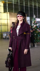 actress Isha Koppikar stylish in sunglasses and a long red coat