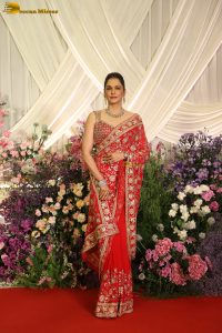 actress isha koppikar gorgeous in a orange red saree