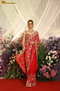 actress isha koppikar gorgeous in a orange red saree