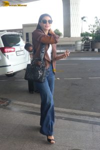 actress Jacqueline Fernandez chic look in jeans and a brown jacket