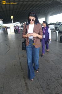 actress Jacqueline Fernandez chic look in jeans and a brown jacket