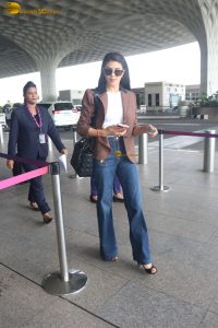 actress Jacqueline Fernandez chic look in jeans and a brown jacket