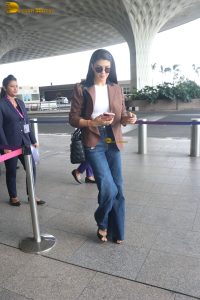 actress Jacqueline Fernandez chic look in jeans and a brown jacket