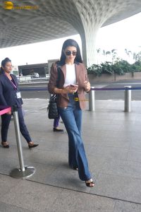 actress Jacqueline Fernandez chic look in jeans and a brown jacket