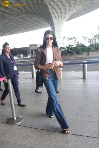 actress Jacqueline Fernandez chic look in jeans and a brown jacket
