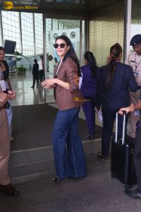 actress Jacqueline Fernandez chic look in jeans and a brown jacket