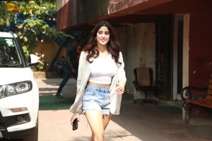 Actress Janhvi Kapoor in a white top and denim shorts