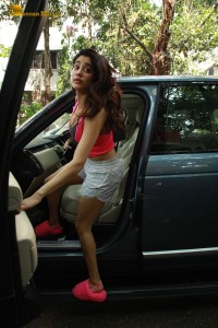 Indian Actress Janhvi Kapoor in a pink top and white shorts