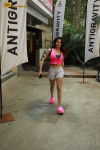 Indian Actress Janhvi Kapoor in a pink top and white shorts