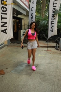 Indian Actress Janhvi Kapoor in a pink top and white shorts