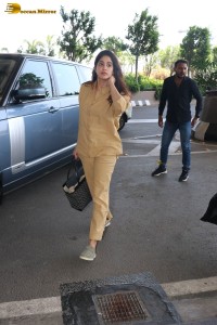 actress janhvi kapoor in brown overalls at airport