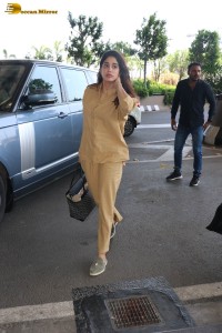 actress janhvi kapoor in brown overalls at airport