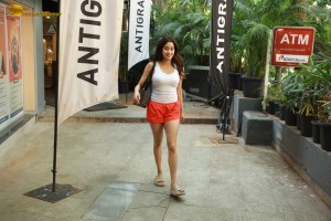 Bollywood Actress Janhvi Kapoor in white top and orange shorts