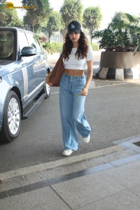 actress janhvi kapoor pretty in a white top and denim jeans at airport