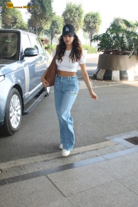actress janhvi kapoor pretty in a white top and denim jeans at airport