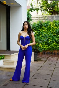 Bollywood Actress Janhvi Kapoor in a blue shoulderless dress