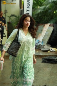 Bollywood Actress Janhvi Kapoor in a green salwar dress