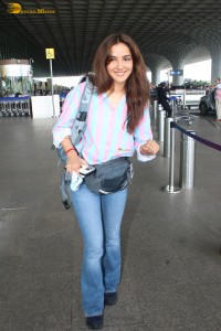 actress Jasmin Bhasin in a shirt and denim jeans at mumbai airport