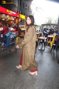 actress jiya shankar cute in a red thigh skirt and brown jacket