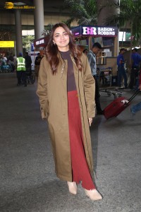 actress jiya shankar cute in a red thigh skirt and brown jacket