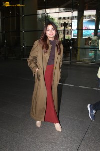 actress jiya shankar cute in a red thigh skirt and brown jacket