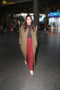 actress jiya shankar cute in a red thigh skirt and brown jacket