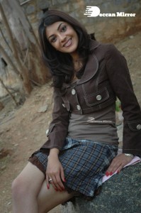 Actress Kajal Aggarwal in a brown coat and grey skirt