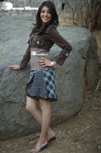 Actress Kajal Aggarwal in a brown coat and grey skirt