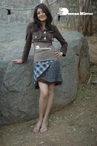 Actress Kajal Aggarwal in a brown coat and grey skirt