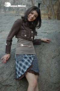 Actress Kajal Aggarwal in a brown coat and grey skirt